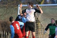 Beccles defender rises but ball hits the bar