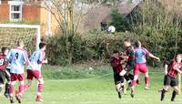 Mills flicks the ball towards the goal