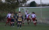 In the gloom, the Lacons keeper works hard