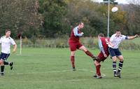 Hempnall player wins the header 2 3