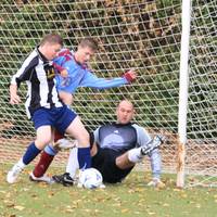 Confusion in the Taverham defence as Laurence Seam