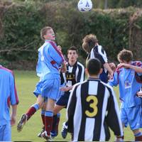 Hempnall's Seaman rises high to win the ball