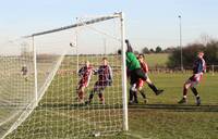 A free kick from Downs sails past keeper blinded b