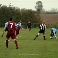 Flint, number 9, scores the first Hempnall goal, t