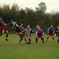 Flint battles away in the opposition penalty area