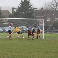 The ball eludes Cudden for the first Acle goal