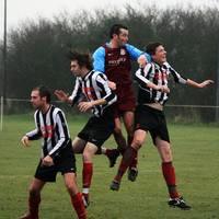 Franklin gets his header away despite the attentio