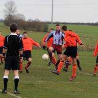 Solley, outnumbered, attacks the ball from a corne