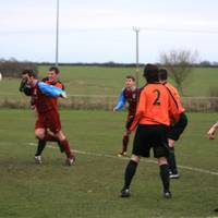 Cawston attacks the ball and the opposition player