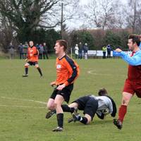 Diving at the feet of the onrushing Cawston, the k