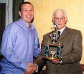 Mark Harvey receiving the POY trophy from Club Pre