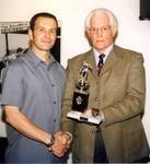 Paul Anderson receiving his POY trophy from Bernar