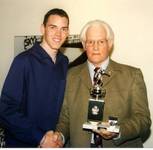 Adam Welstead receiving his POY trophy from Bernar