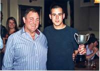 Shaun Flint receiving his award from David Arnold,