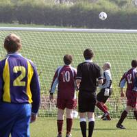 In a rare Acle attack, Erith watches the ball sail