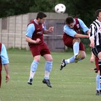 Player and Jackson combine to win the ball in a ga