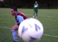 In the descending gloom, Halliwell misses a header