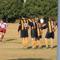 Jones tries to bend a free kick around the wall, b